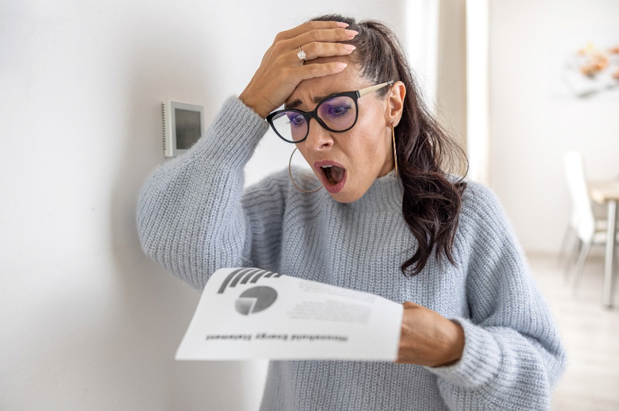 women shocked looking at bill